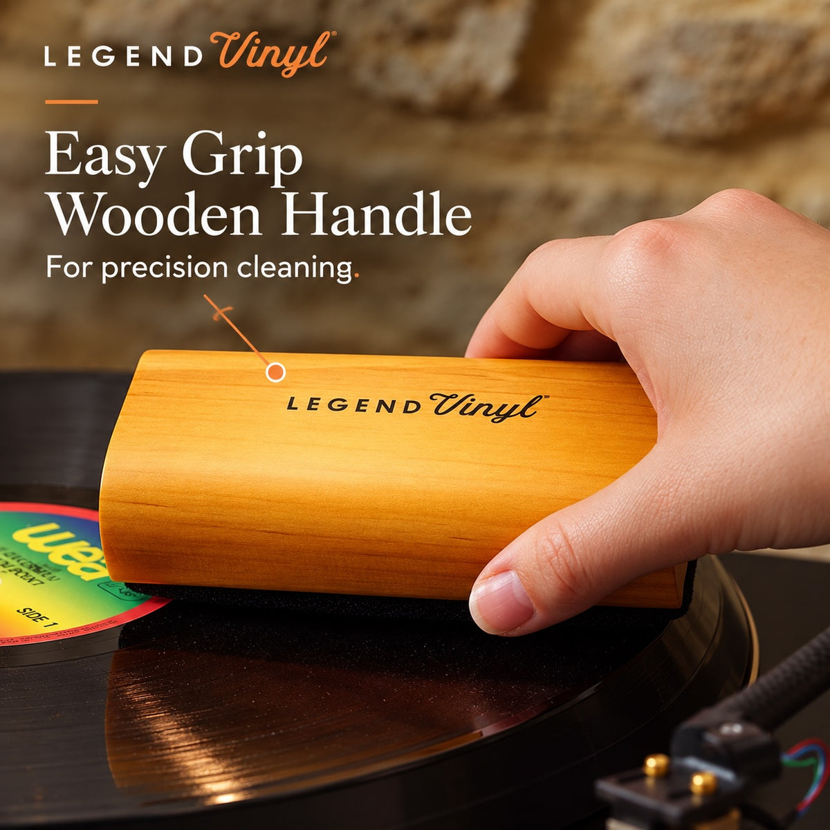 Large velvet dust pad of the LV34 brush resting on a vinyl record