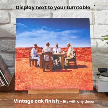 "Now Playing" stand in use displaying an album sleeve